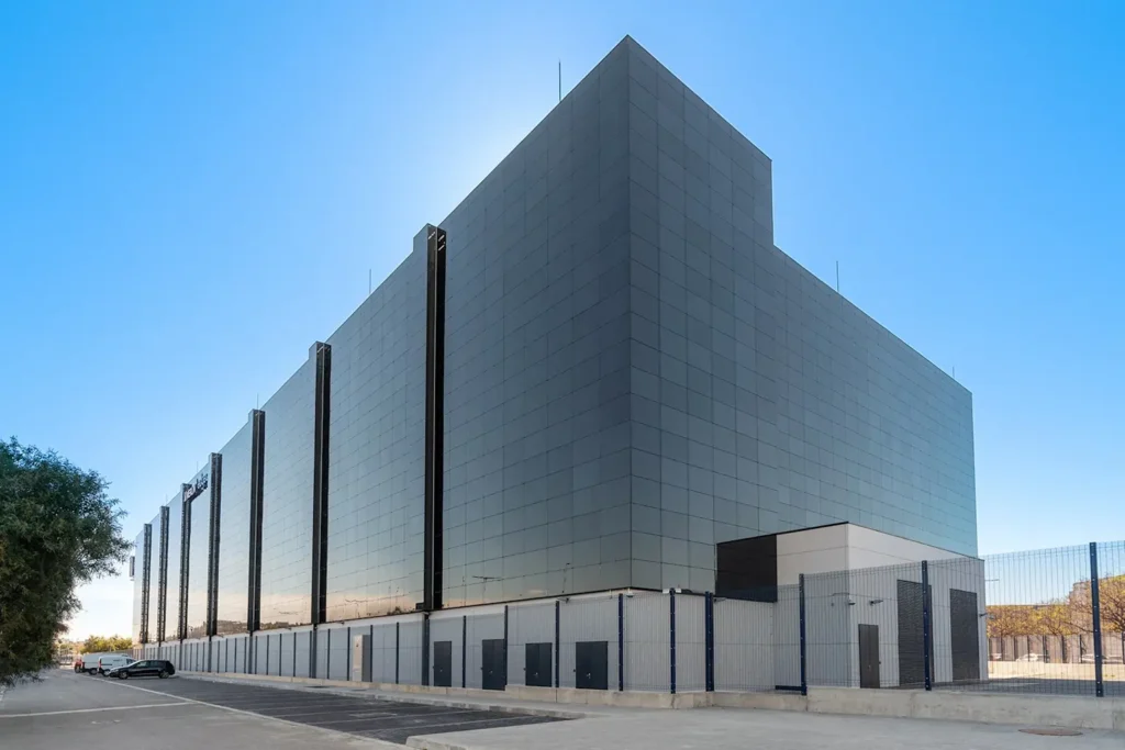 CoreWeave's flagship data center with sleek reflective glass exterior illustrates their advanced infrastructure 