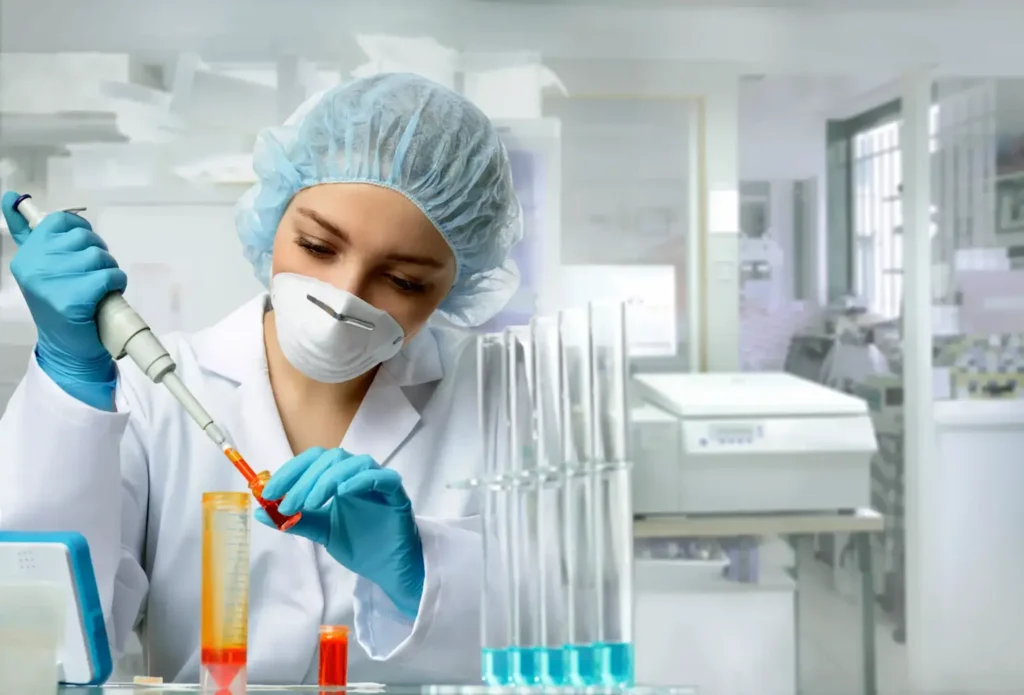 Medical laboratory technician handling samples in a research lab, illustrating healthcare and pharmaceutical research