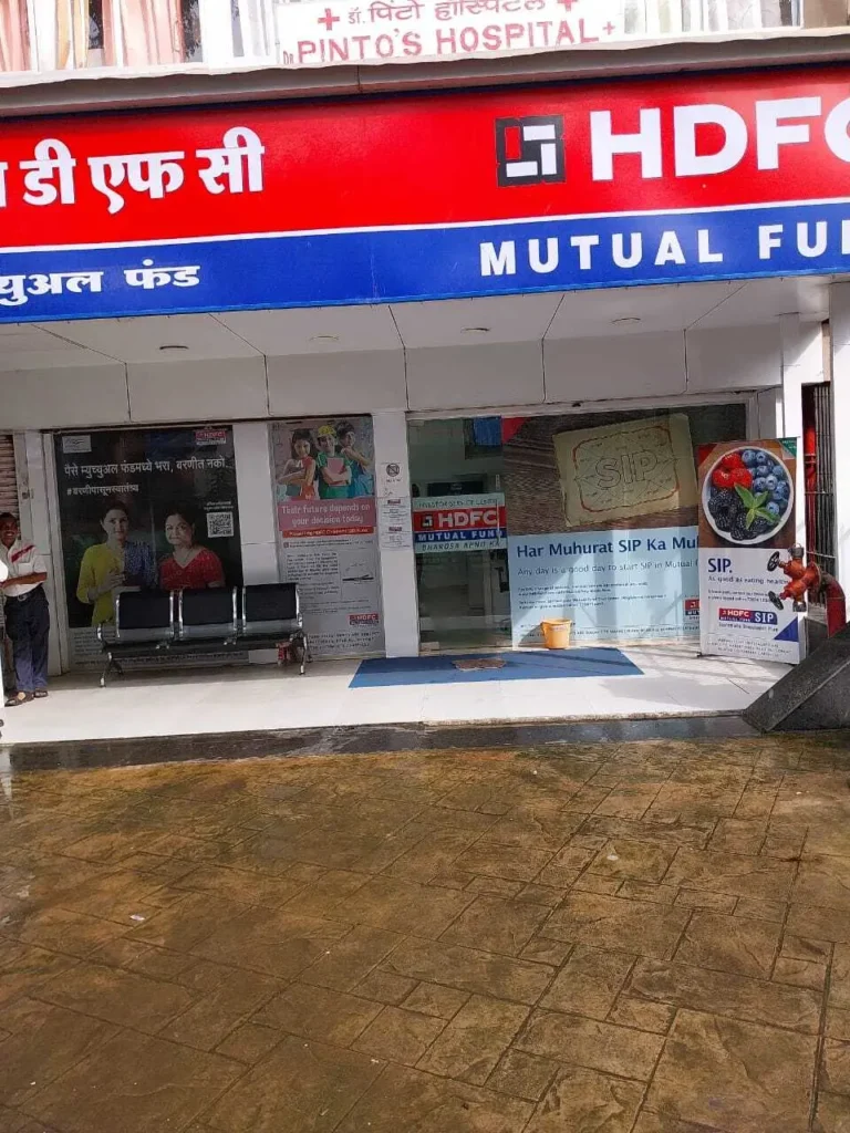 HDFC Mutual Fund office in Mumbai showcasing the company's branding and promotional materials for SIP investments