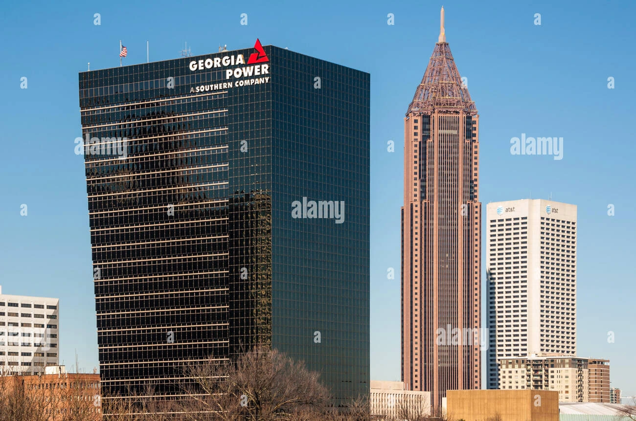 Georgia Power headquarters building in downtown Atlanta with clear skies and surrounding skyscrapers