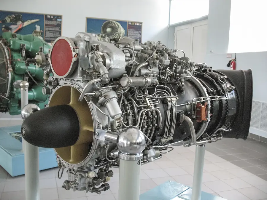 A close-up view of a jet engine showcasing intricate aircraft manufacturing and engineering technology 