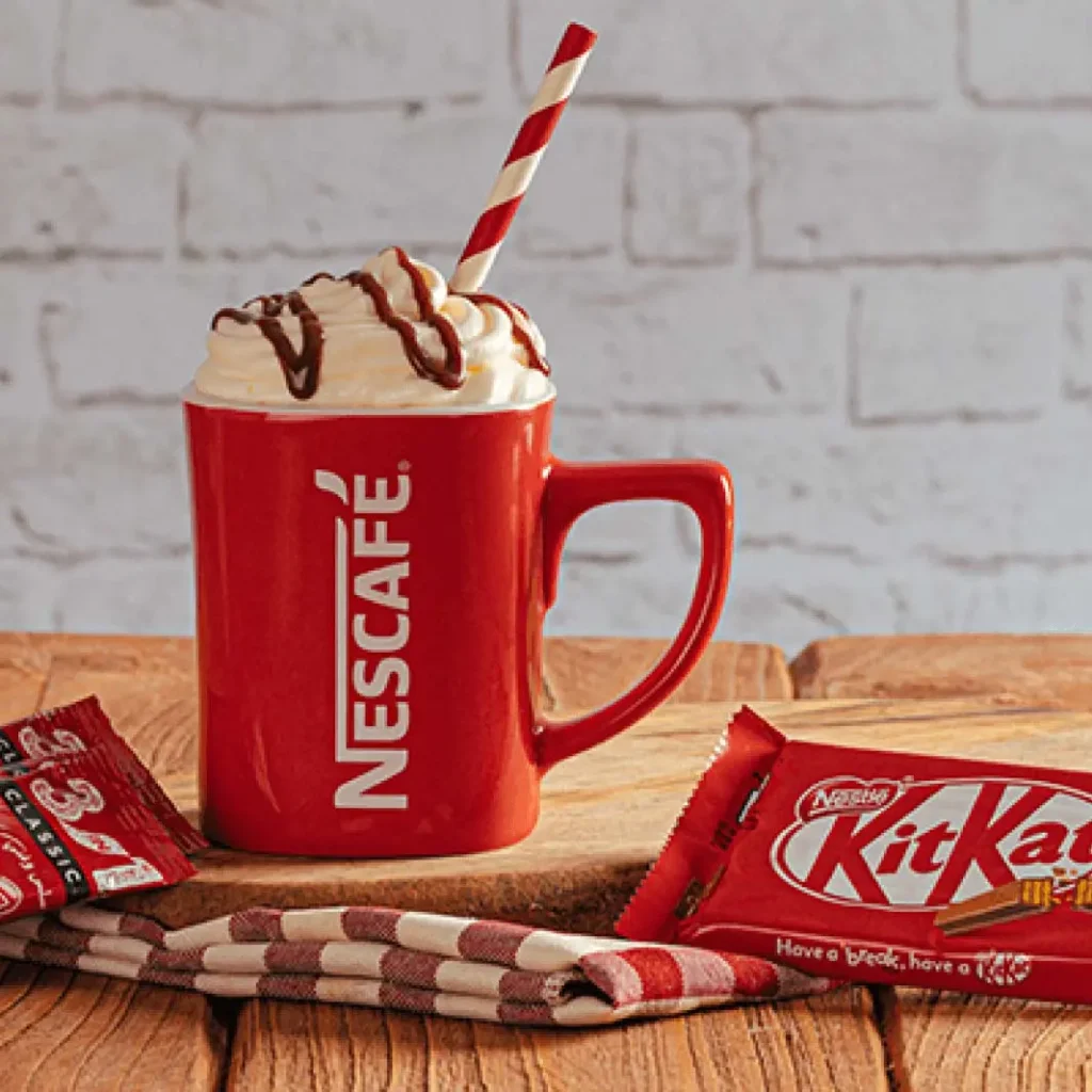 Nescafé coffee and KitKat chocolate showcase Nestle's popular product portfolio in a visually appealing setup 