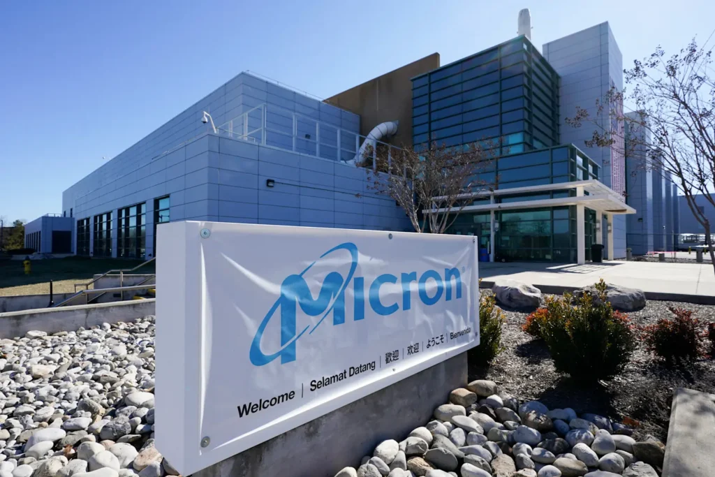Micron Technology's advanced memory chip manufacturing facility in Boise with a multilingual welcome banner 