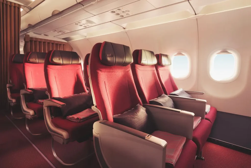 Business class seats showcasing premium travel comfort and luxury inside an airplane cabin